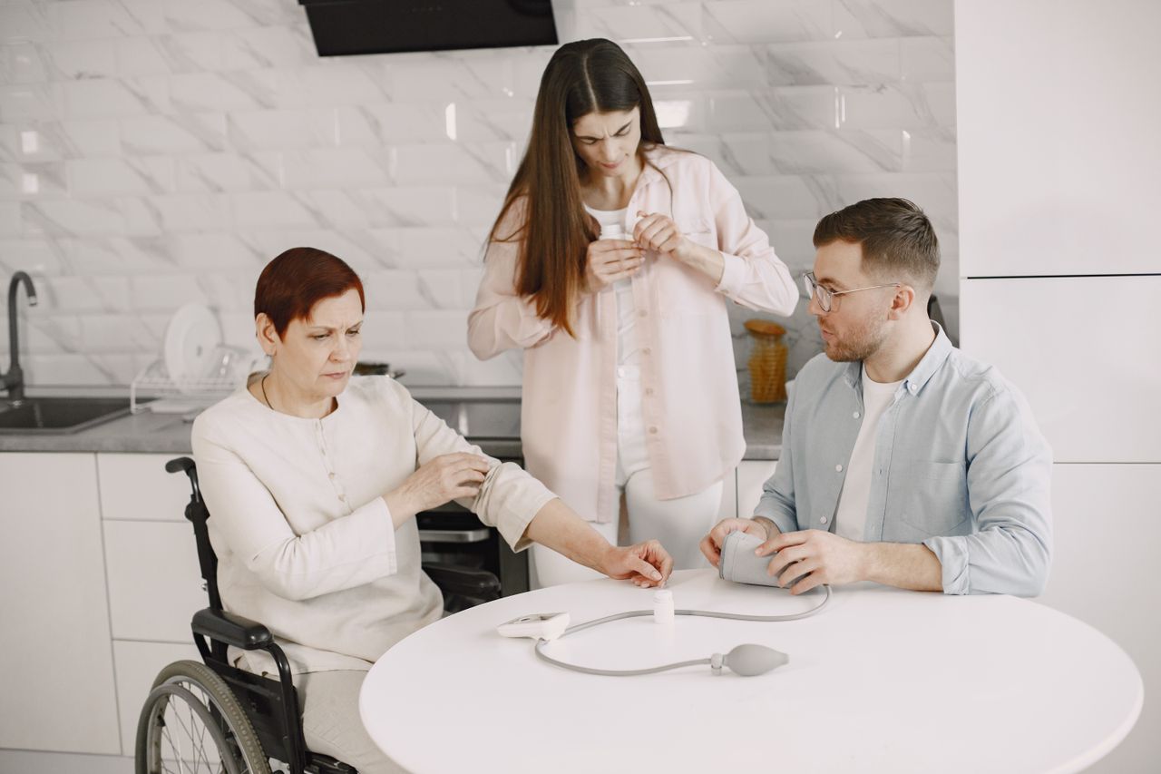 Services A family assists in measuring blood pressure at home, promoting healthcare awareness.